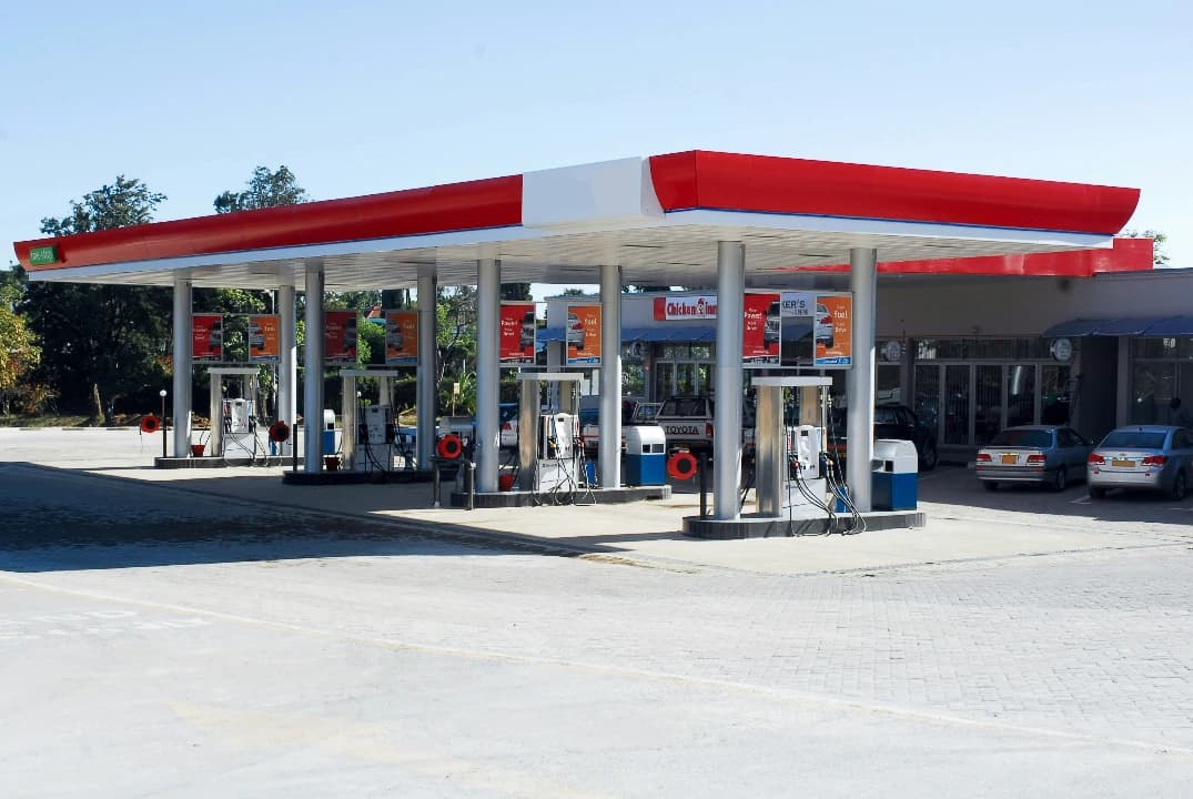 Exterior shot of average gas station in the middle of the day